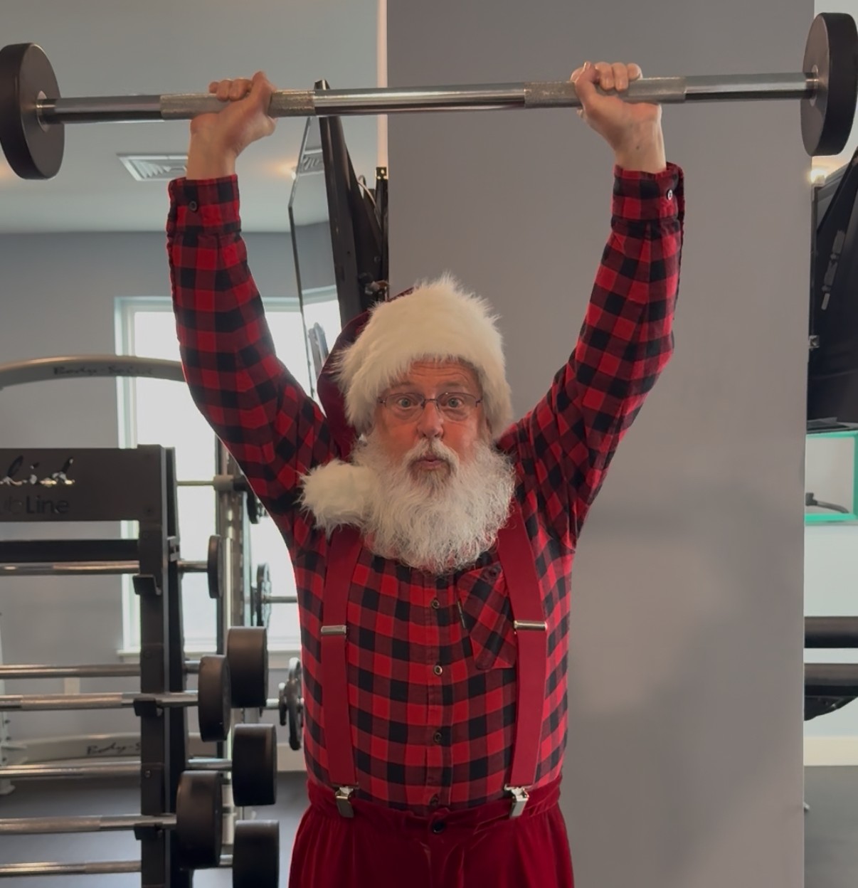 Press moment with Santa Ricky smiling for the camera at an event.